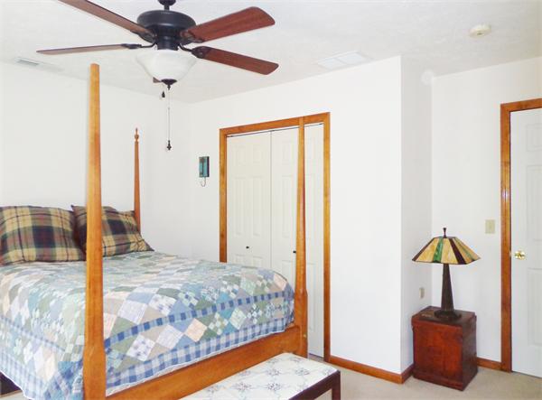 43 Old Poor Farm Road Ware, MA 01082 - Photo 18 of 29 a bedroom with a bed and a chandelier