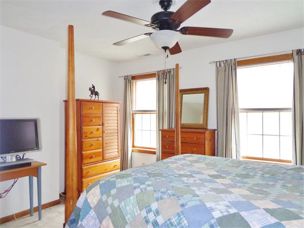 43 Old Poor Farm Road Ware, MA 01082 - Photo 19 of 29 a bedroom with a bed and a flat tv screen on dresser