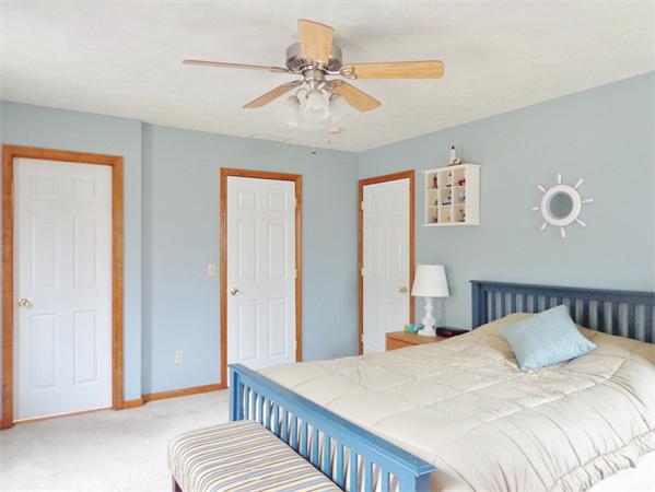 43 Old Poor Farm Road Ware, MA 01082 - Photo 21 of 29 a bedroom with a bed and a chandelier