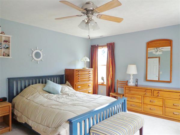 43 Old Poor Farm Road Ware, MA 01082 - Photo 8 of 29 a bedroom with a bed a chandelier and dresser