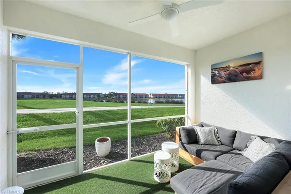 a living room with furniture and a yard