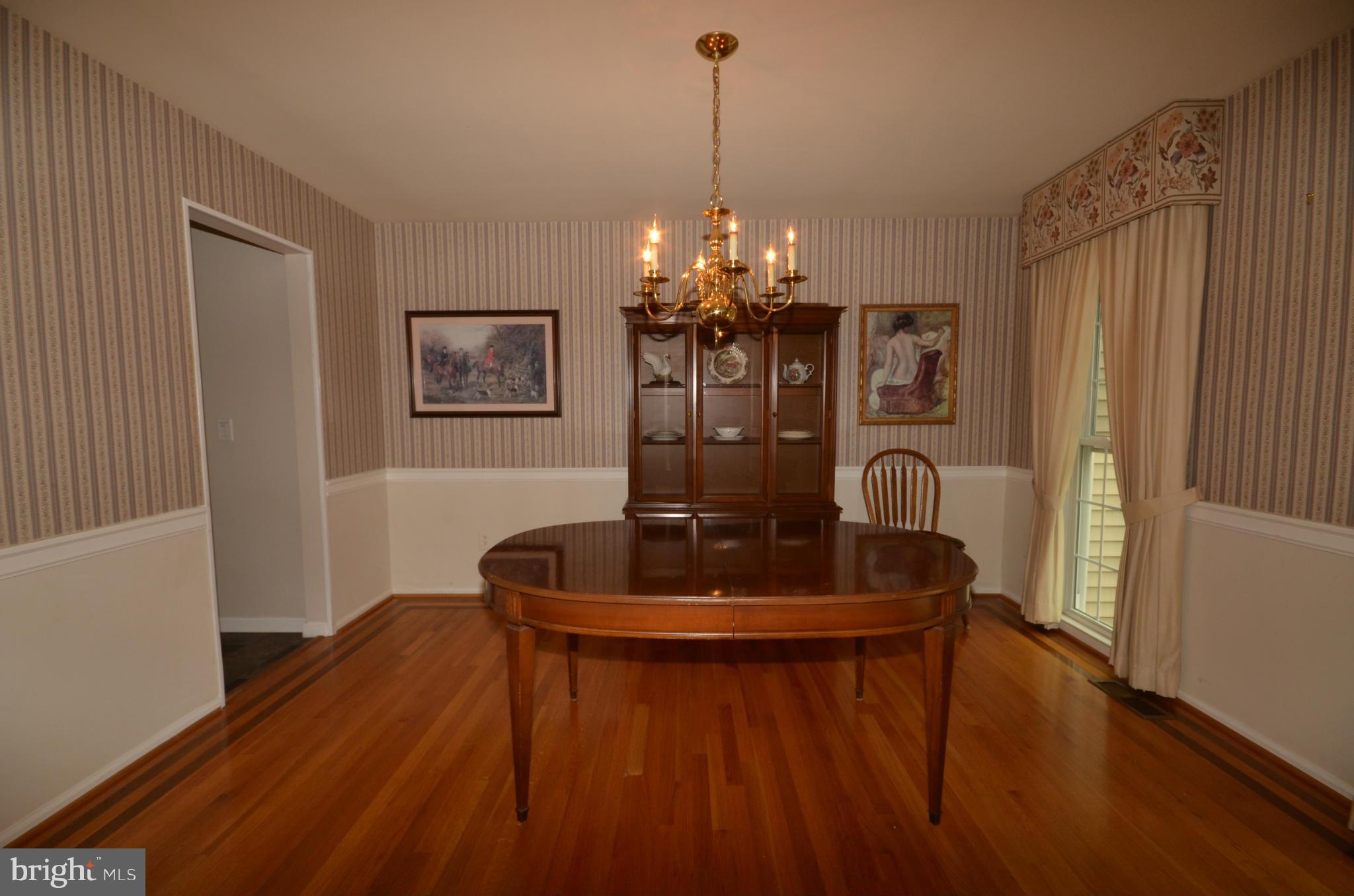 122 Peyton Road Sterling, VA 20165 - Photo 8 of 25 Lovely formal dining room with hard wood flooring