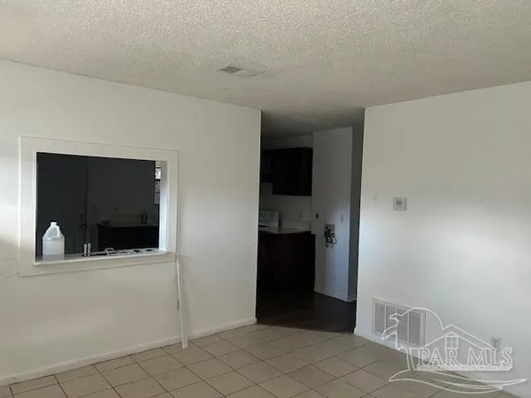 a view of an entryway with a microwave