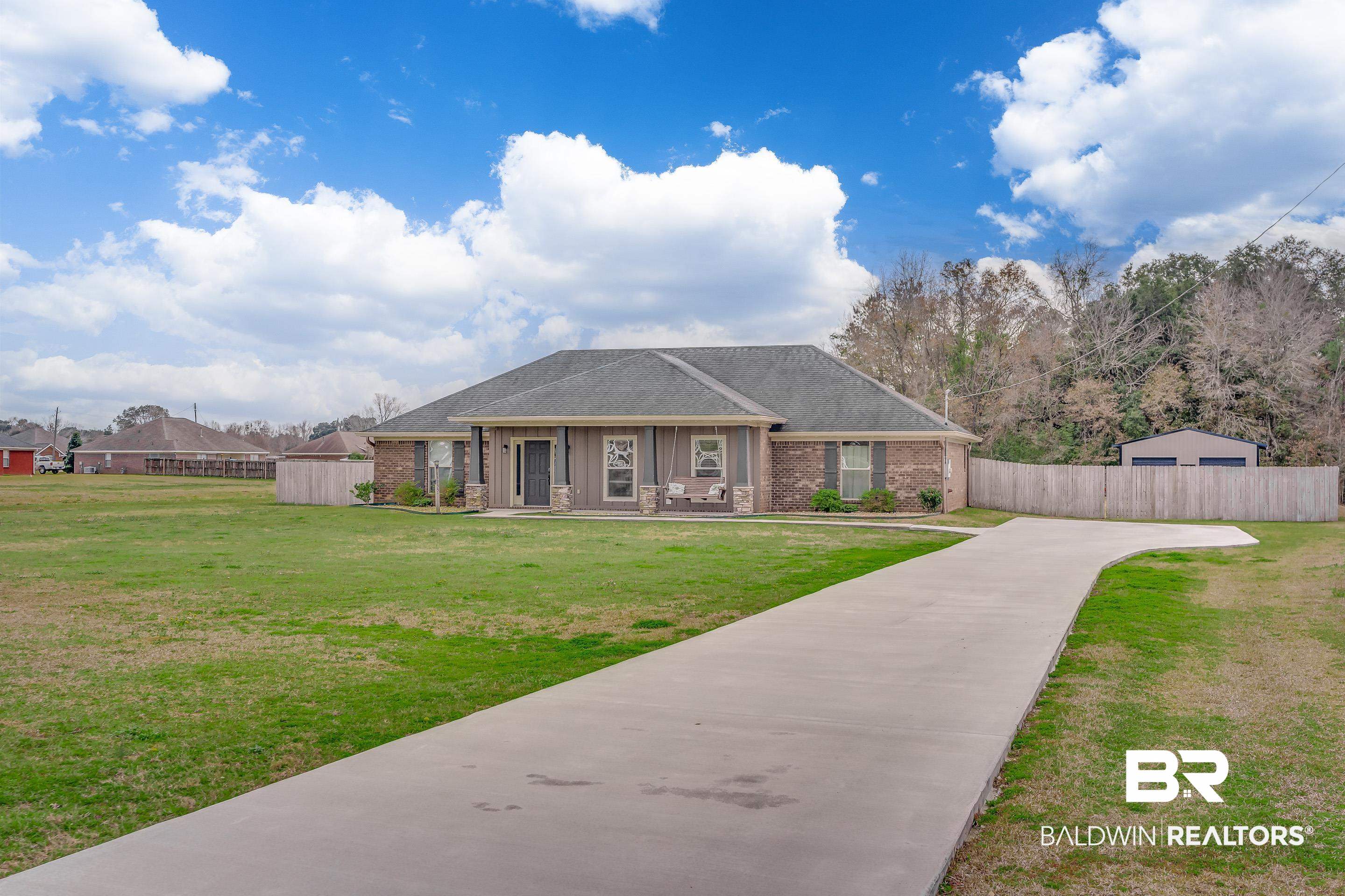 13235 Tom Gaston Road Mobile, AL 36695 - Photo 38 of 43 View of front of property with a front lawn and covered porch
