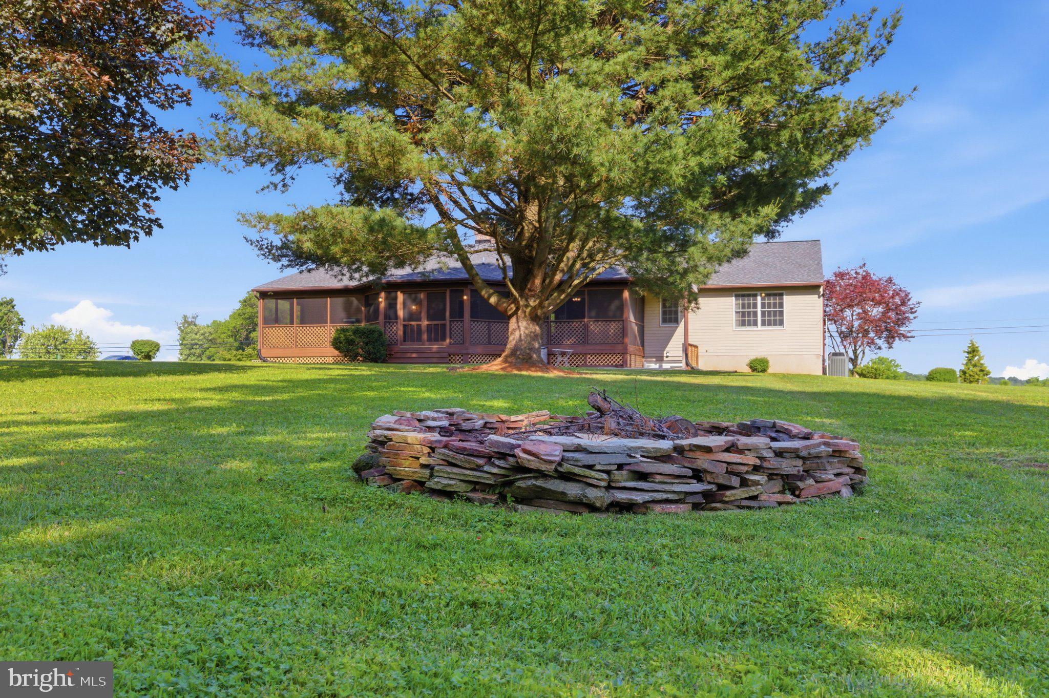 18310 Upper Beckleysville Road Hampstead, MD 21074 - Photo 52 of 67 Serene backyard with fire pit charm.