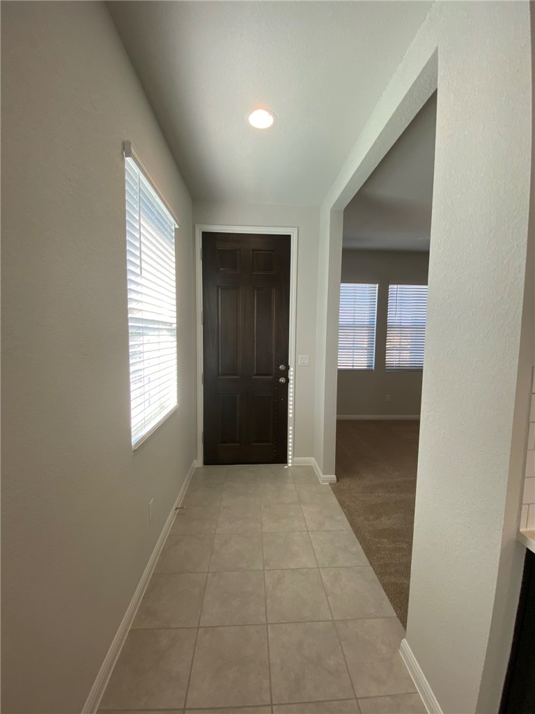384 Gaida Loop Georgetown, TX 78628 - Photo 4 of 20 Welcome to 384 Gaida Loop. Upon entry you will see a flex room that can be used as an office, study, play area, sitting room or your liking.