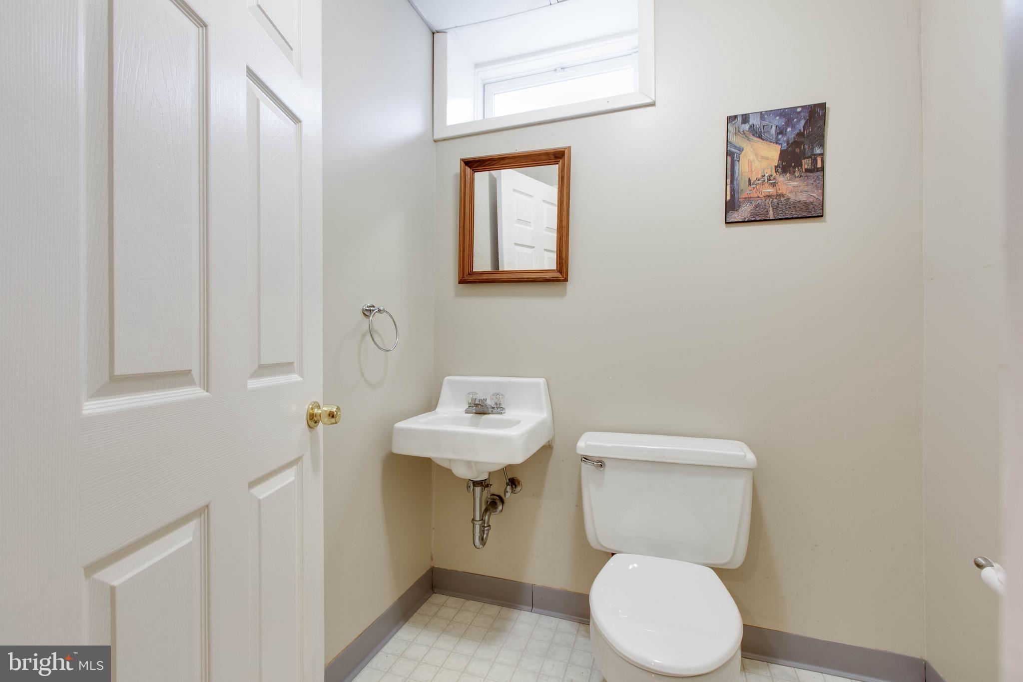 5519 Woodbine Road Sykesville, MD 21784 - Photo 39 of 69 a bathroom with a toilet and a sink
