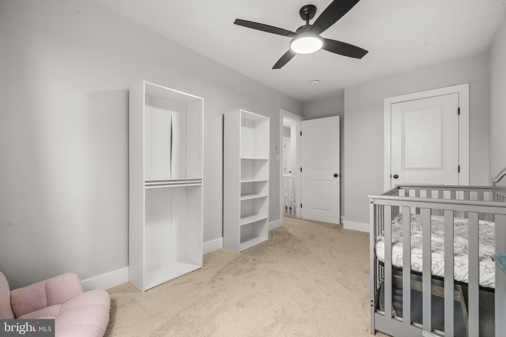3707 Dunlap Street Temple Hills, MD 20748 - Photo 15 of 30 a view of empty room with wooden floor and ceiling fan
