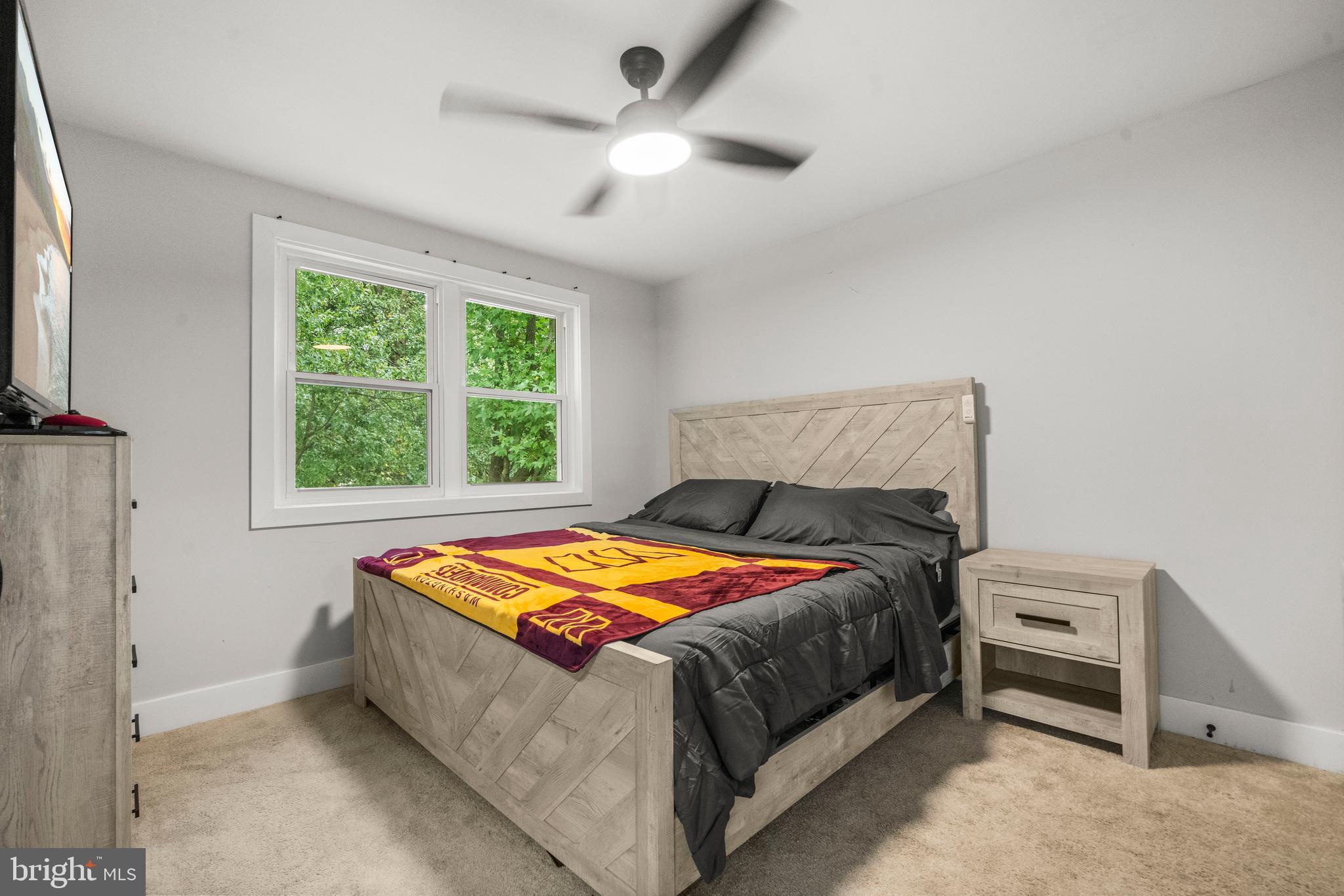 3707 Dunlap Street Temple Hills, MD 20748 - Photo 19 of 30 a bedroom with a bed and a window
