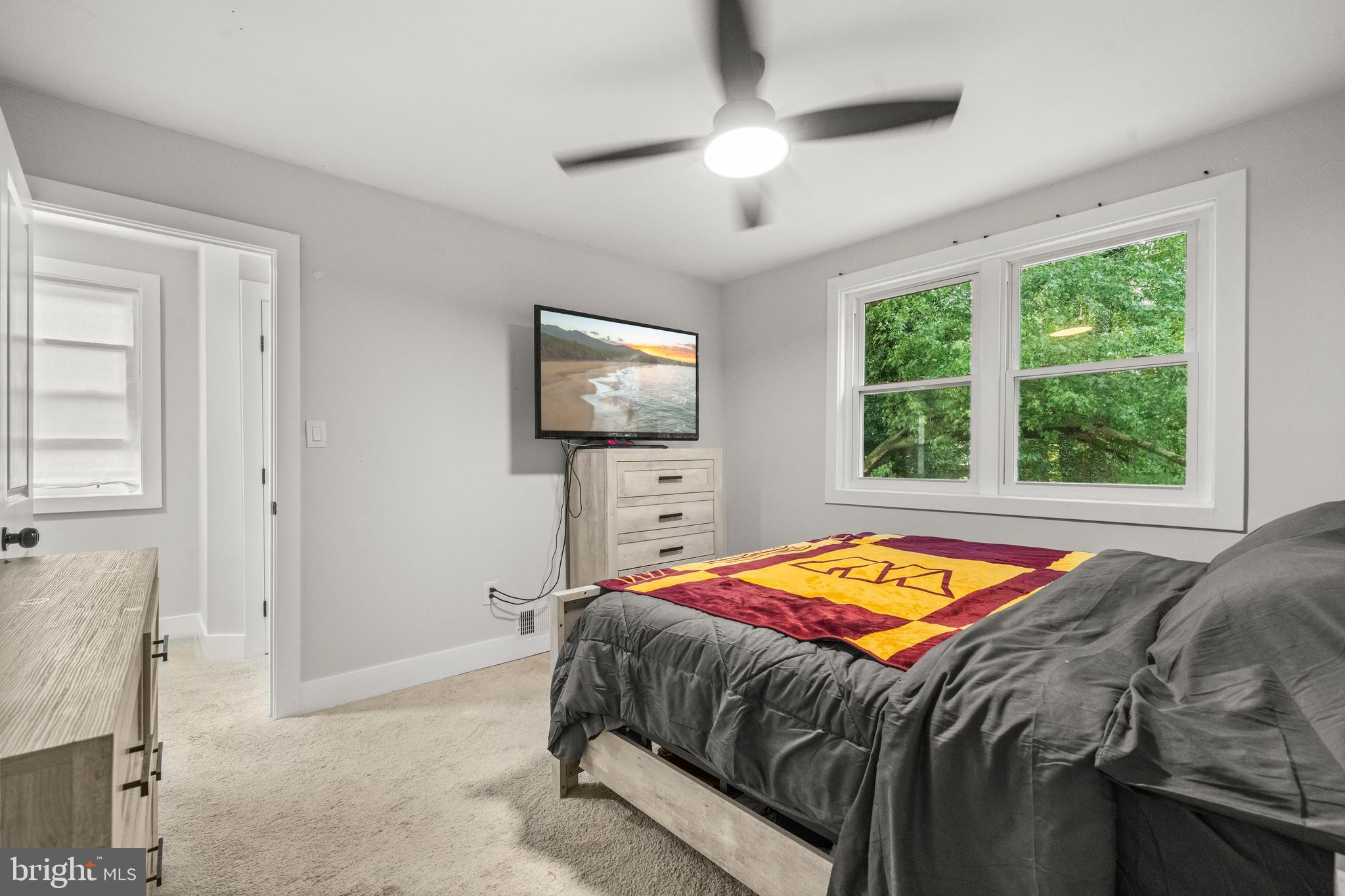 3707 Dunlap Street Temple Hills, MD 20748 - Photo 20 of 30 a bedroom with a bed and a flat screen tv