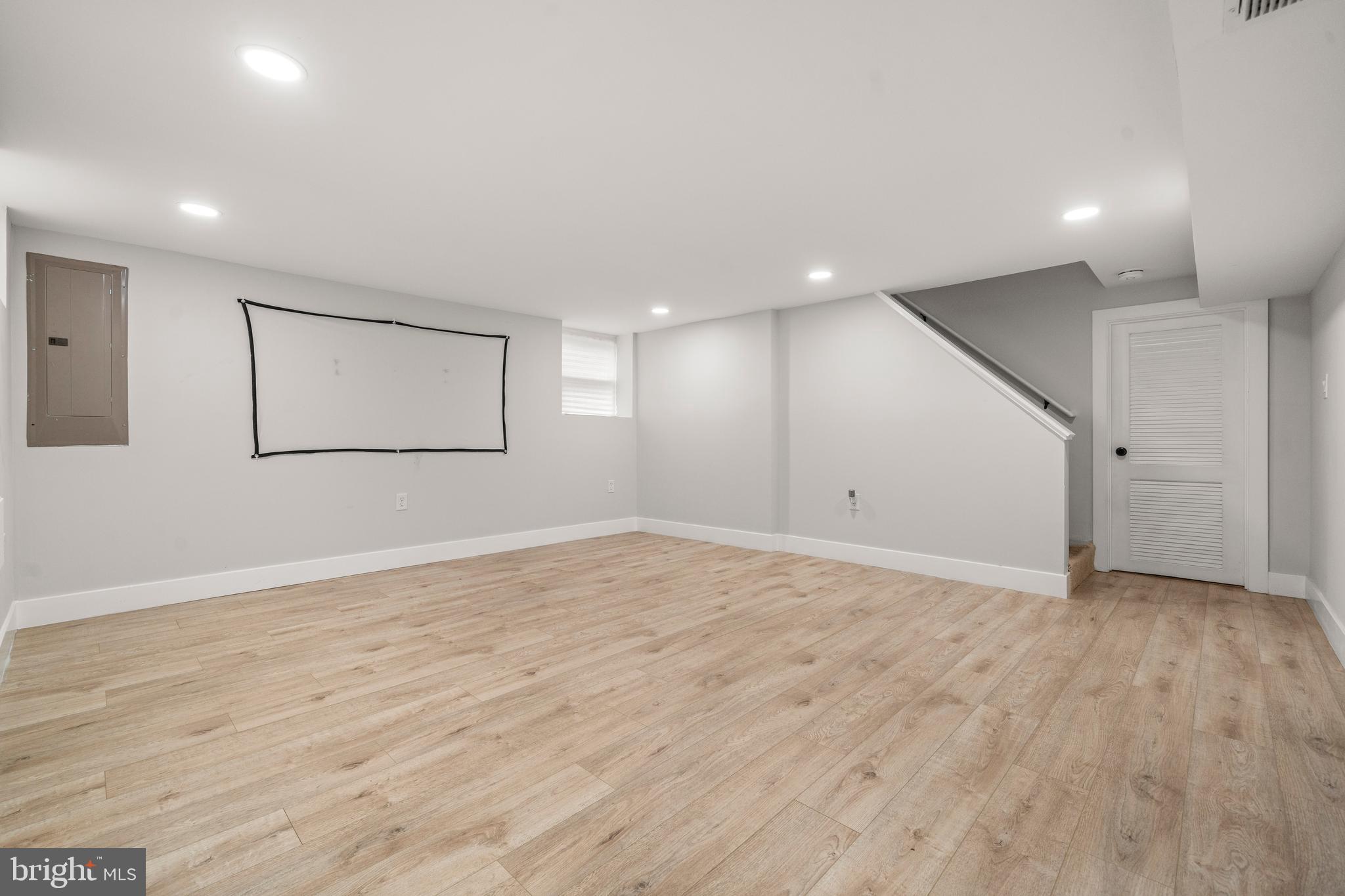 3707 Dunlap Street Temple Hills, MD 20748 - Photo 22 of 30 a view of an empty room with wooden floor