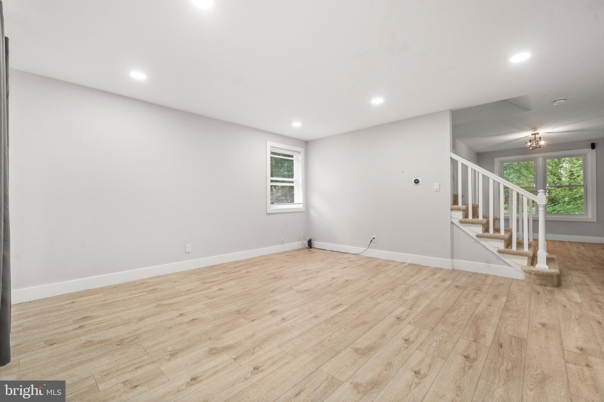 3707 Dunlap Street Temple Hills, MD 20748 - Photo 3 of 30 a view of an empty room with wooden floor
