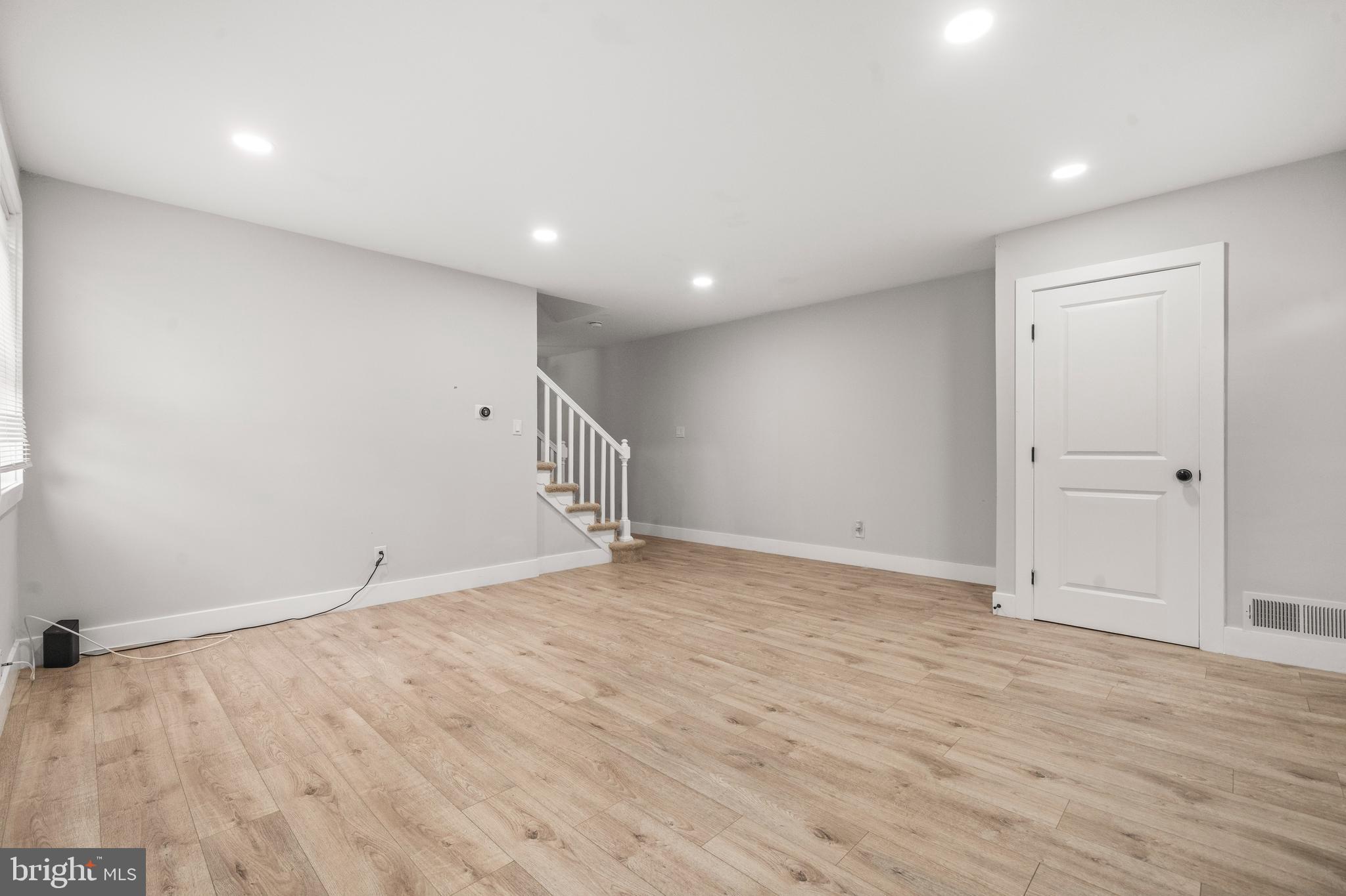 3707 Dunlap Street Temple Hills, MD 20748 - Photo 6 of 30 an empty room with wooden floor and white walls