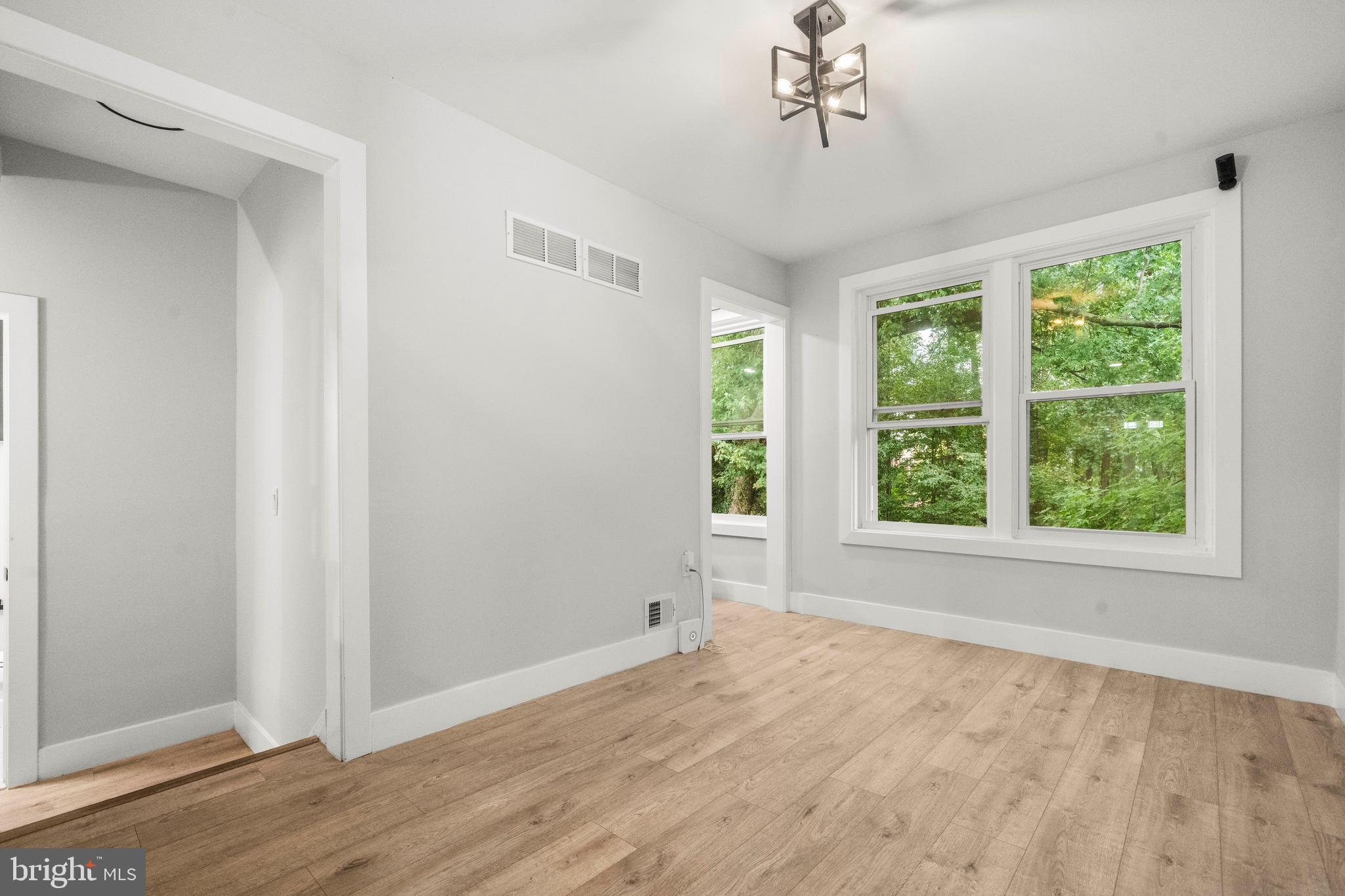 3707 Dunlap Street Temple Hills, MD 20748 - Photo 10 of 30 a view of empty room with wooden floor and fan