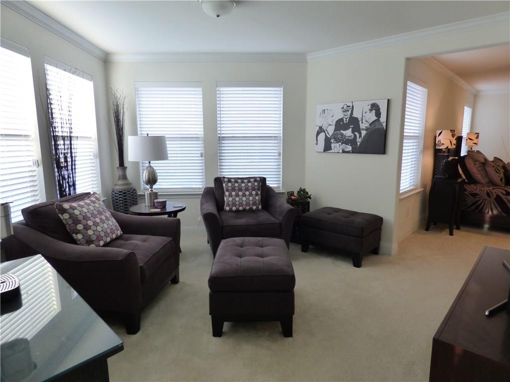 1216 Yellow Iris Road Leander, TX 78641 - Photo 22 of 33 a living room with furniture and a window