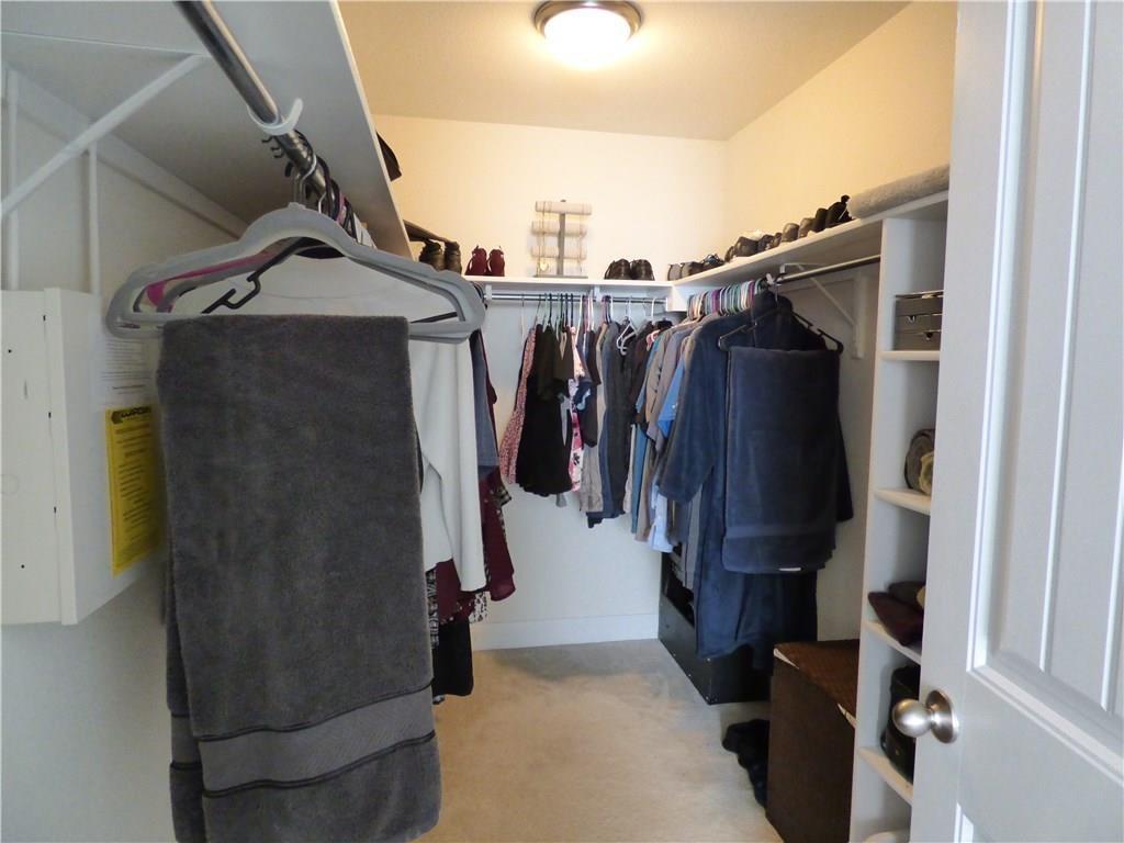 1216 Yellow Iris Road Leander, TX 78641 - Photo 25 of 33 a view of walk in closet with clothes and shoes