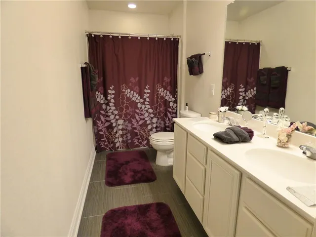 a bathroom with a sink and toilet