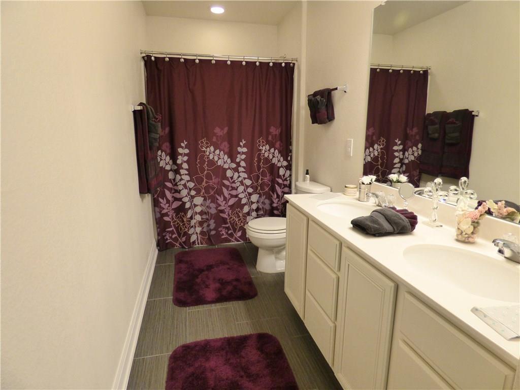 1216 Yellow Iris Road Leander, TX 78641 - Photo 29 of 33 a bathroom with a sink and toilet