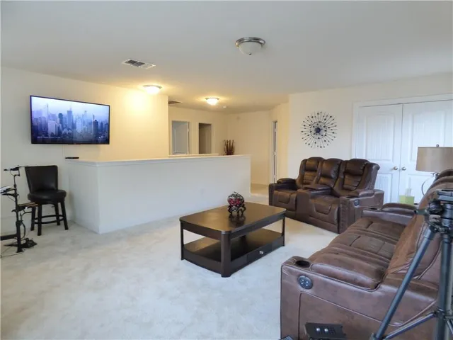 a living room with furniture and a couch
