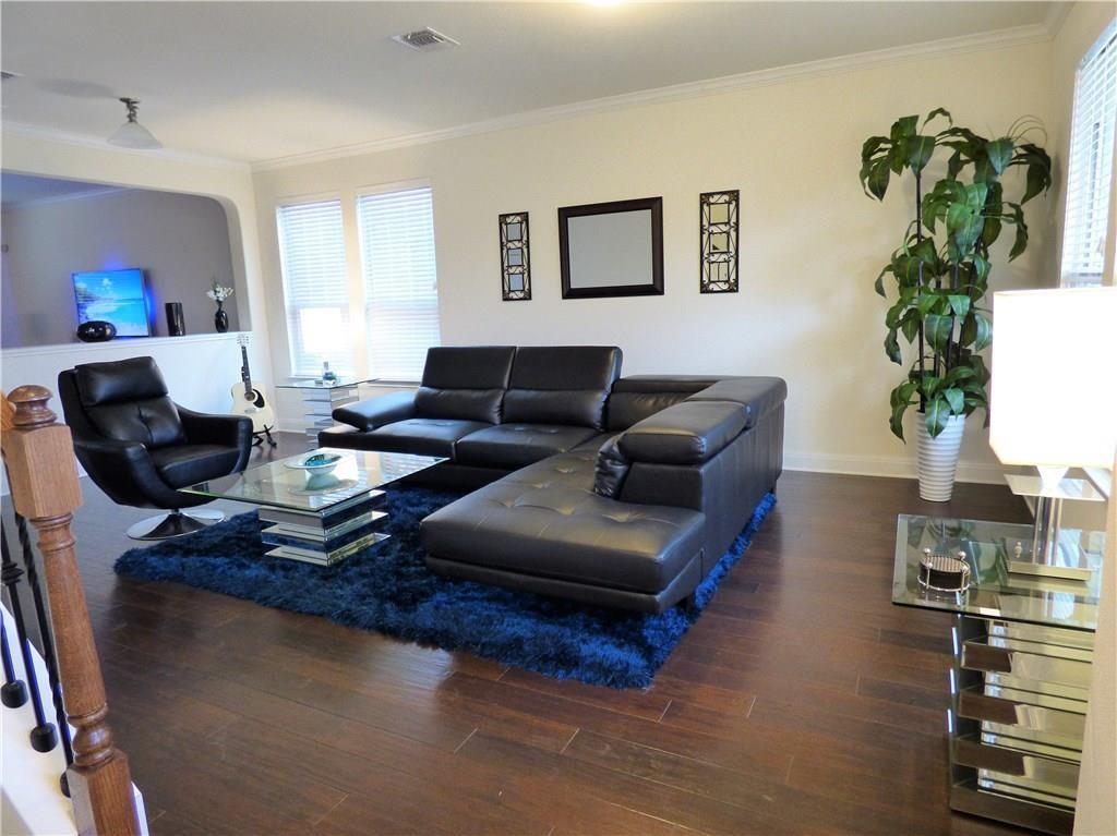 1216 Yellow Iris Road Leander, TX 78641 - Photo 4 of 33 a living room with furniture kitchen view and a potted plant