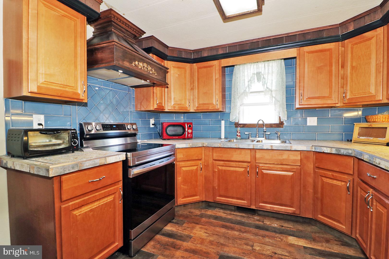 16 Partridge Place Whiting, NJ 08759 - Photo 14 of 29 a kitchen with stainless steel appliances granite countertop a sink a stove and a refrigerator