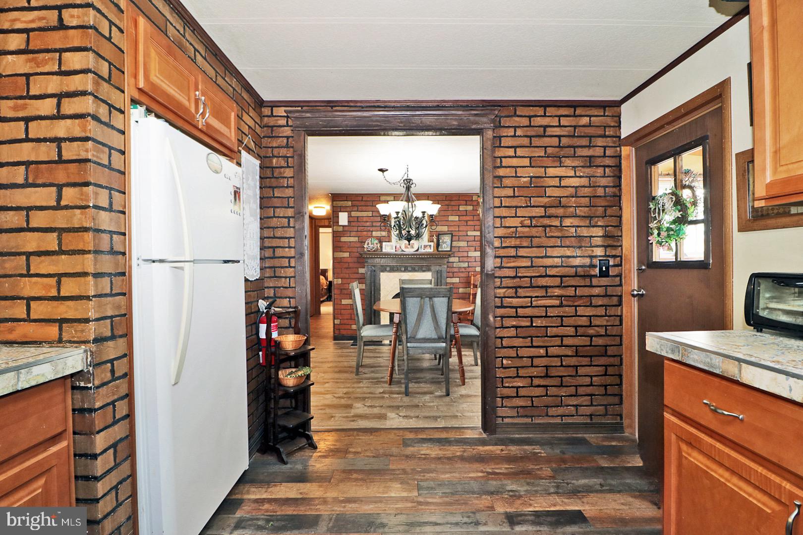 16 Partridge Place Whiting, NJ 08759 - Photo 15 of 29 a view of a hallway with a dining table and chairs