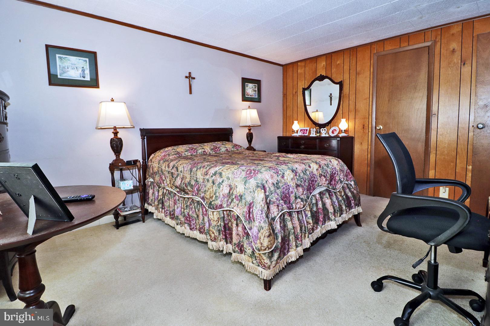 16 Partridge Place Whiting, NJ 08759 - Photo 19 of 29 a bedroom with a bed a dresser and chair