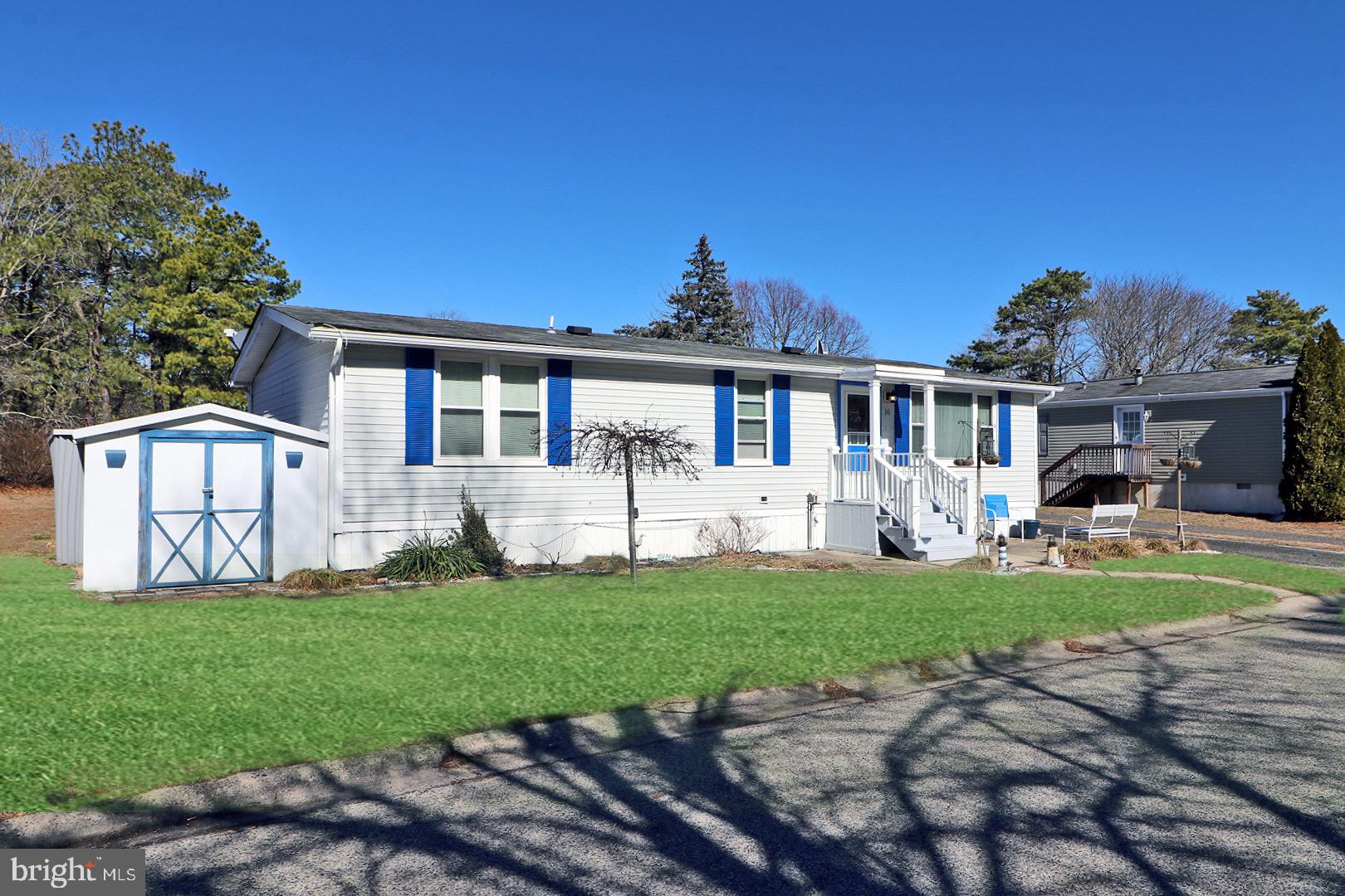 16 Partridge Place Whiting, NJ 08759 - Photo 2 of 29 a front view of a house with a yard and porch