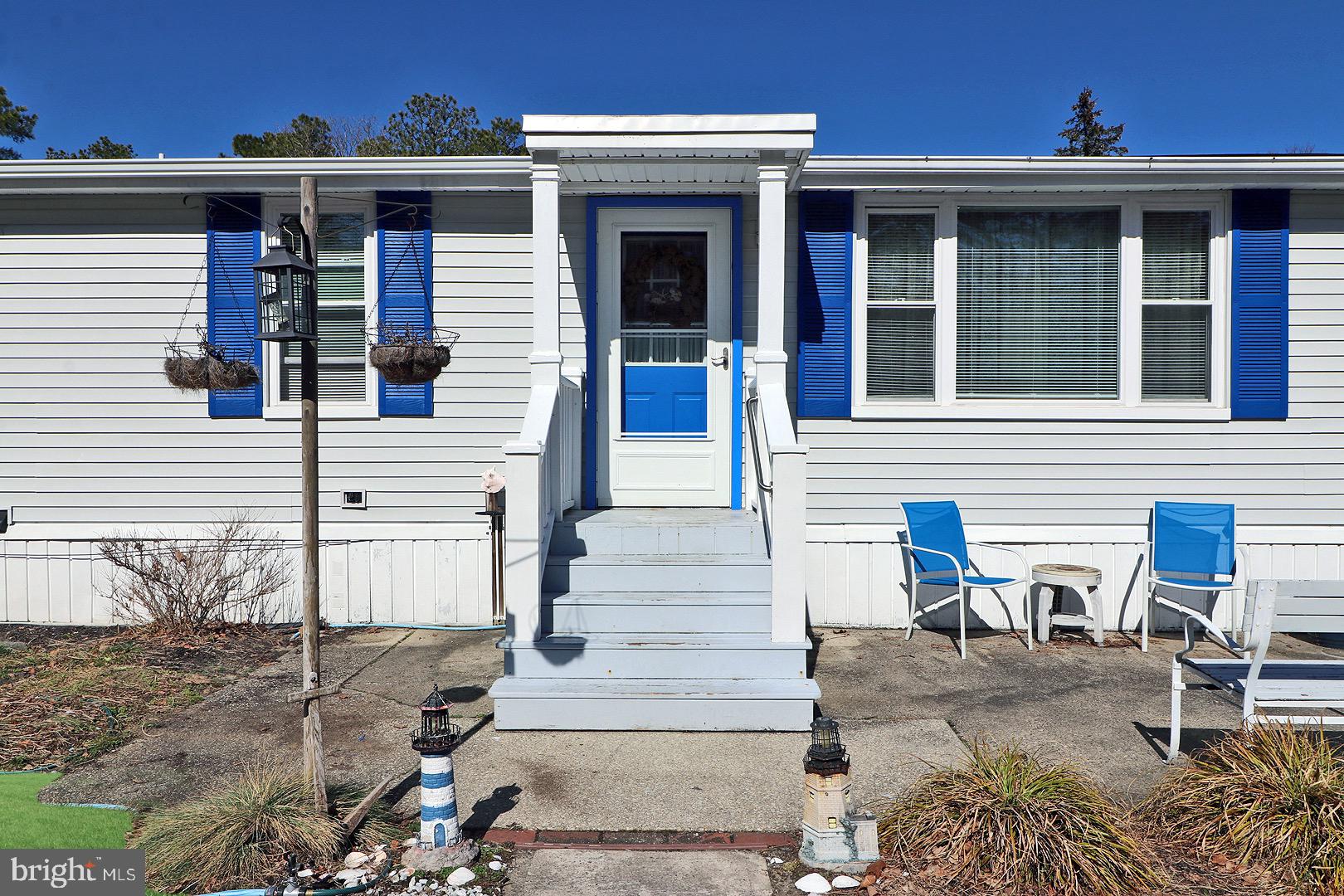 16 Partridge Place Whiting, NJ 08759 - Photo 29 of 29 front view of a house with a chairs and table in the patio