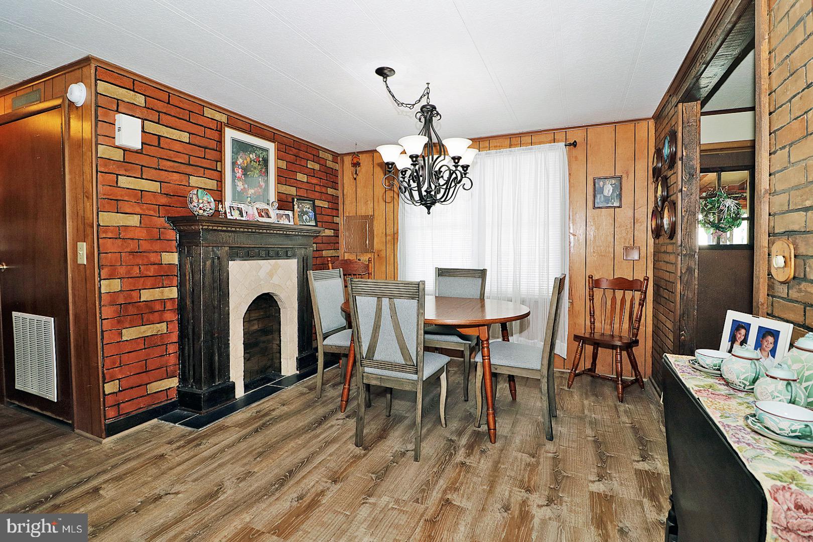 16 Partridge Place Whiting, NJ 08759 - Photo 10 of 29 a dining room with furniture a fireplace and wooden floor