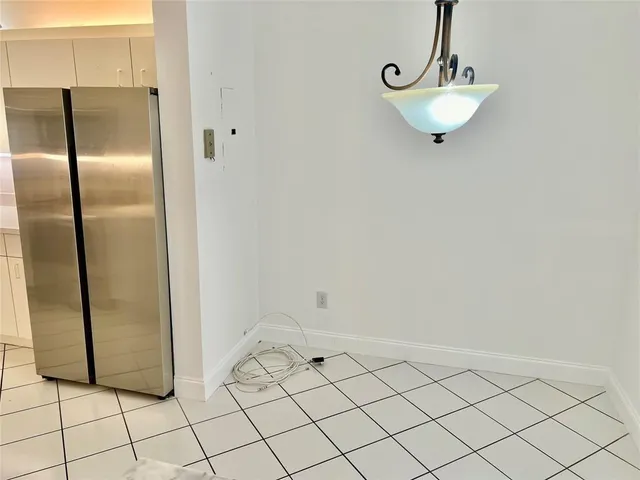 a view of a refrigerator and window