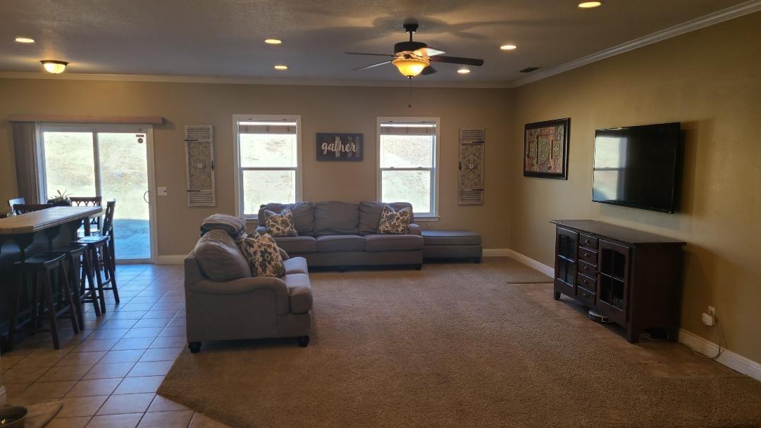 28937 Auberry Road Prather, CA 93651 - Photo 4 of 6 a living room with furniture and a flat screen tv
