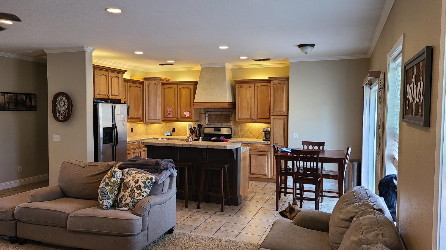 28937 Auberry Road Prather, CA 93651 - Photo 6 of 6 a living room with furniture and a dining table with kitchen view
