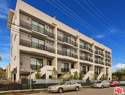 a front view of a building with street view