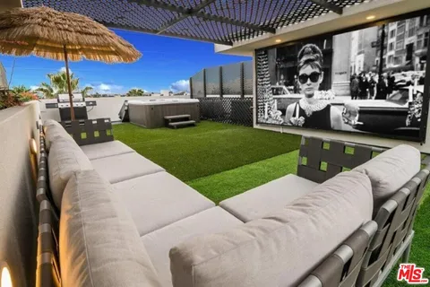 a view of a balcony with furniture