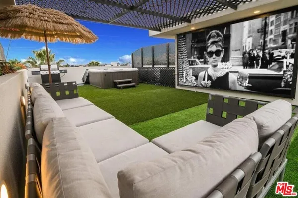 a view of a balcony with furniture