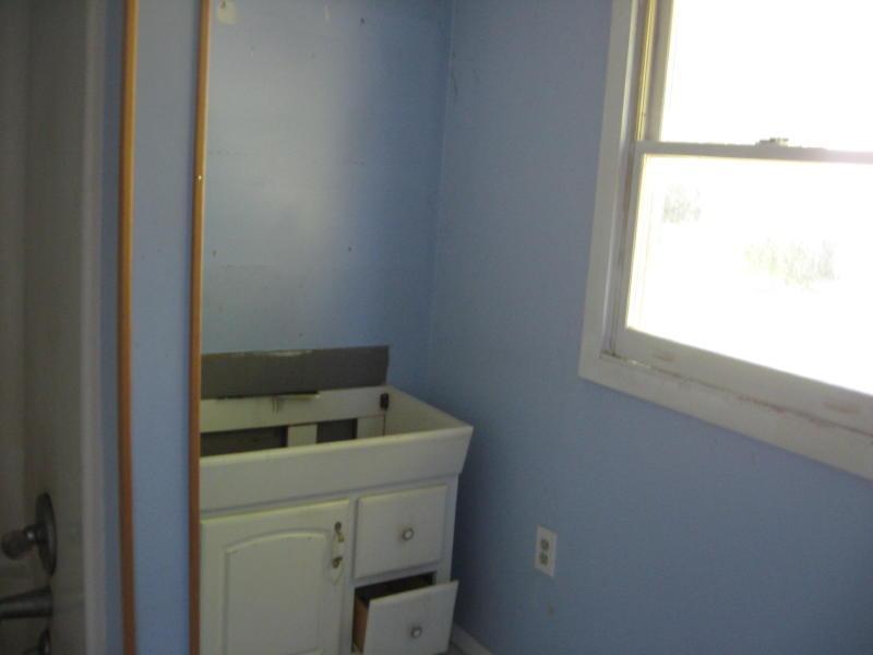 3755 Bandy Road Roanoke, VA 24014 - Photo 5 of 5 a bathroom with a toilet sink and window