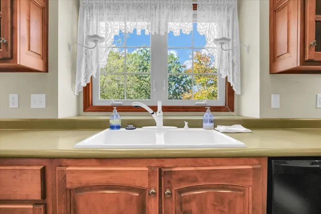 a kitchen with a sink and a window