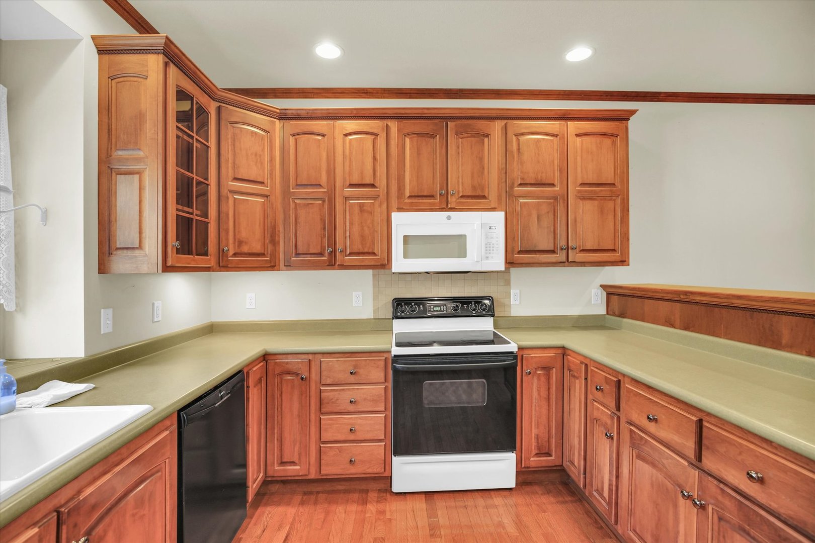 2424 Prairie Ridge Place Champaign, IL 61822 - Photo 14 of 48 a kitchen with stainless steel appliances granite countertop a stove a sink and a microwave