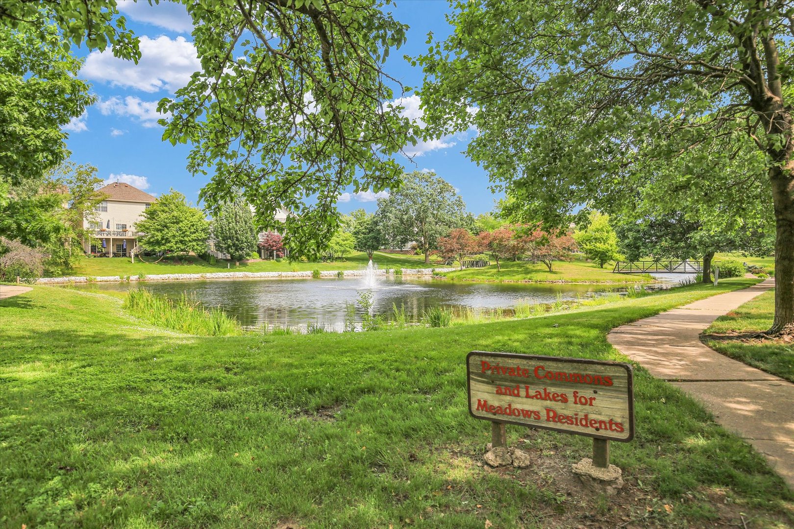 2424 Prairie Ridge Place Champaign, IL 61822 - Photo 27 of 48 a view of a lake with houses