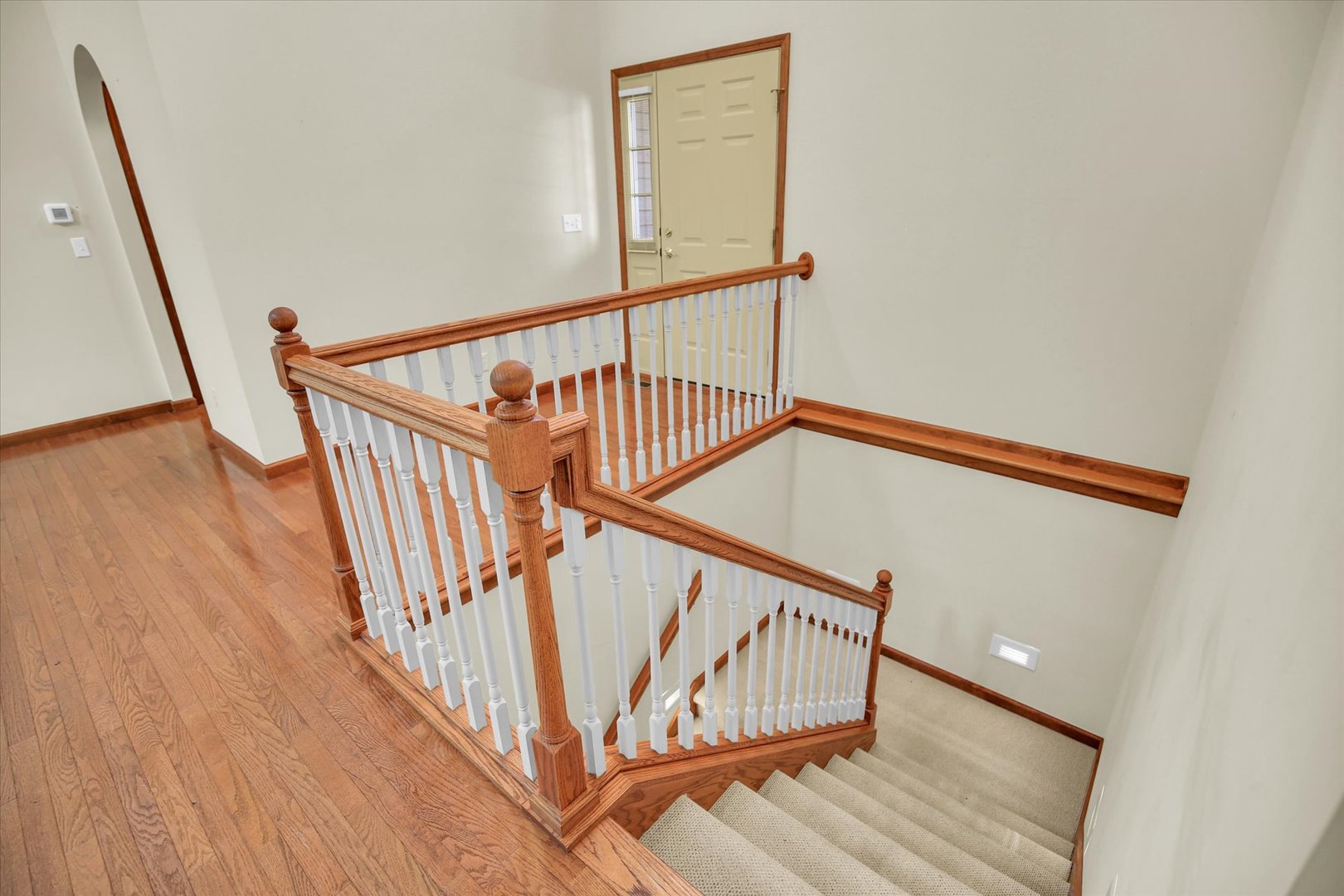 2424 Prairie Ridge Place Champaign, IL 61822 - Photo 30 of 48 a view of staircase with railing and white walls