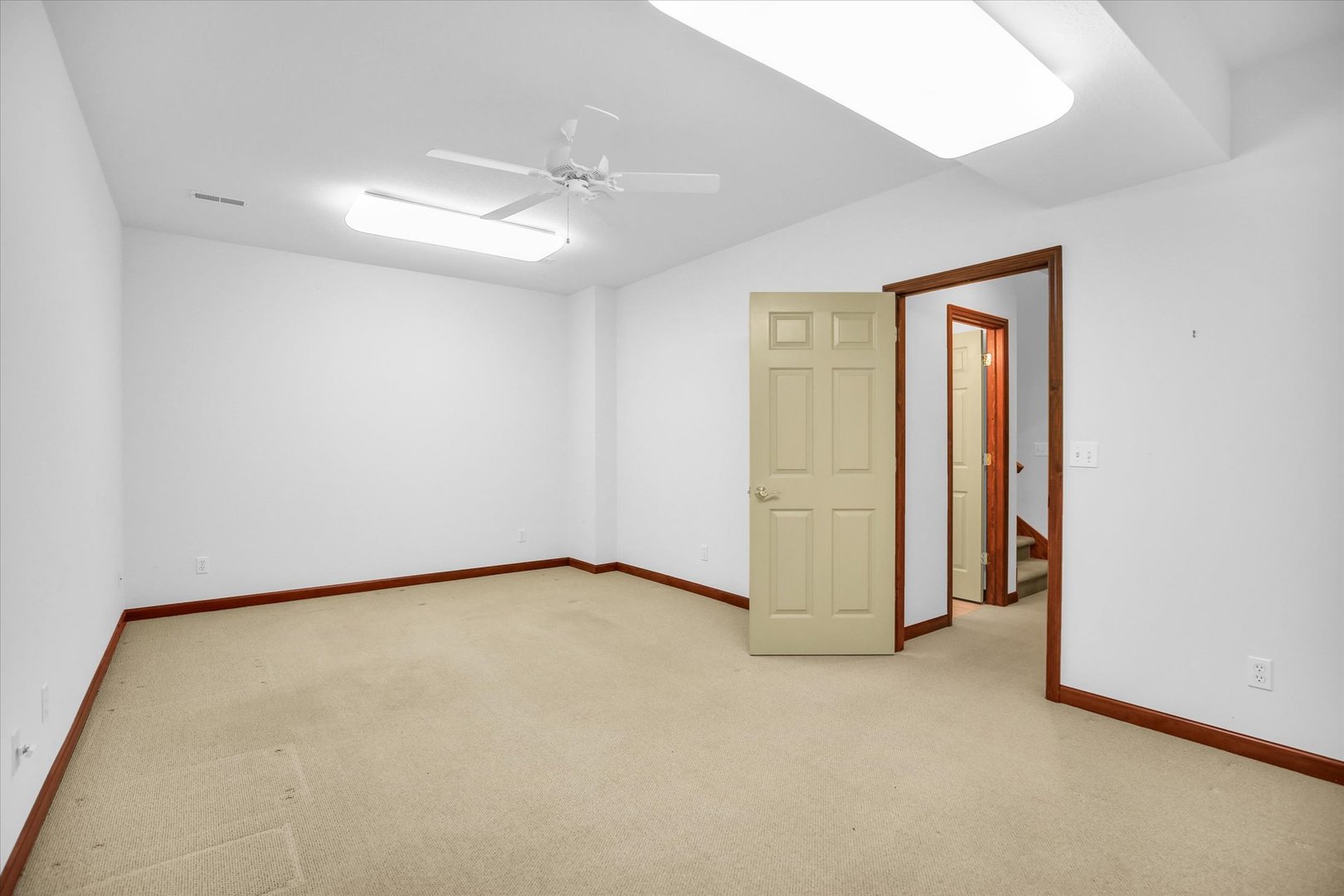 2424 Prairie Ridge Place Champaign, IL 61822 - Photo 32 of 48 an empty room with a ceiling fan and closet area