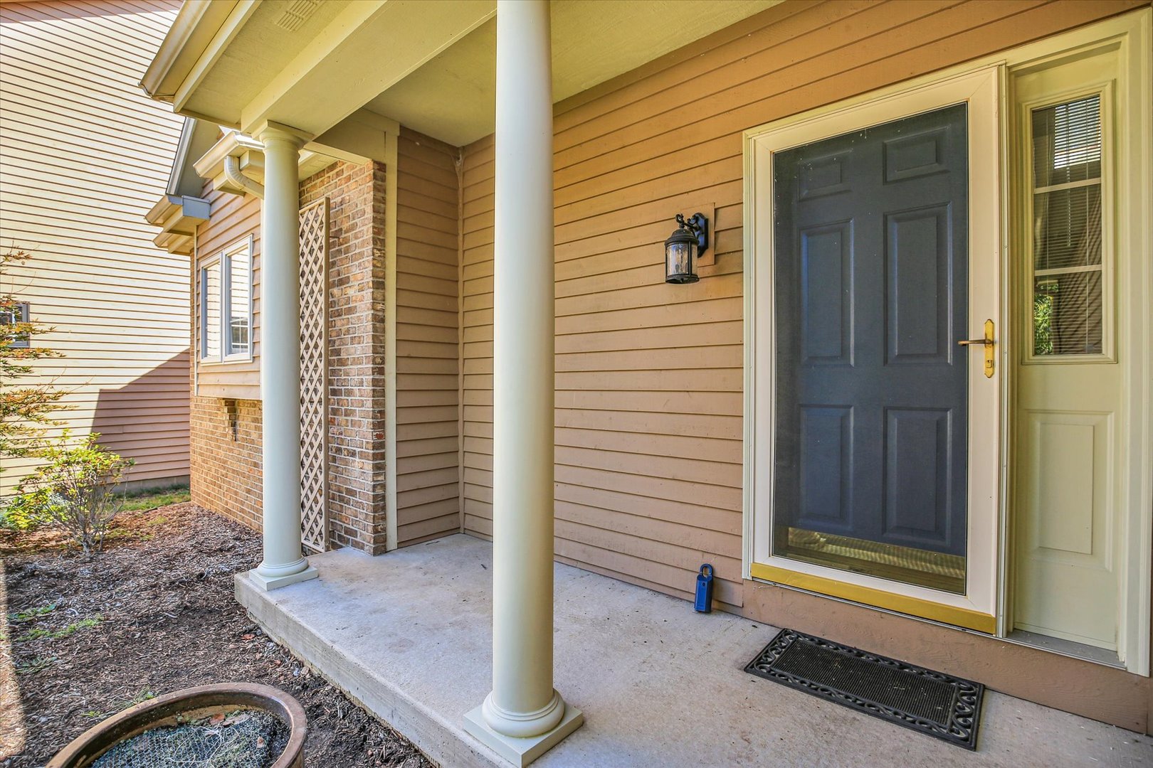 2424 Prairie Ridge Place Champaign, IL 61822 - Photo 4 of 48 a view of a door and a window