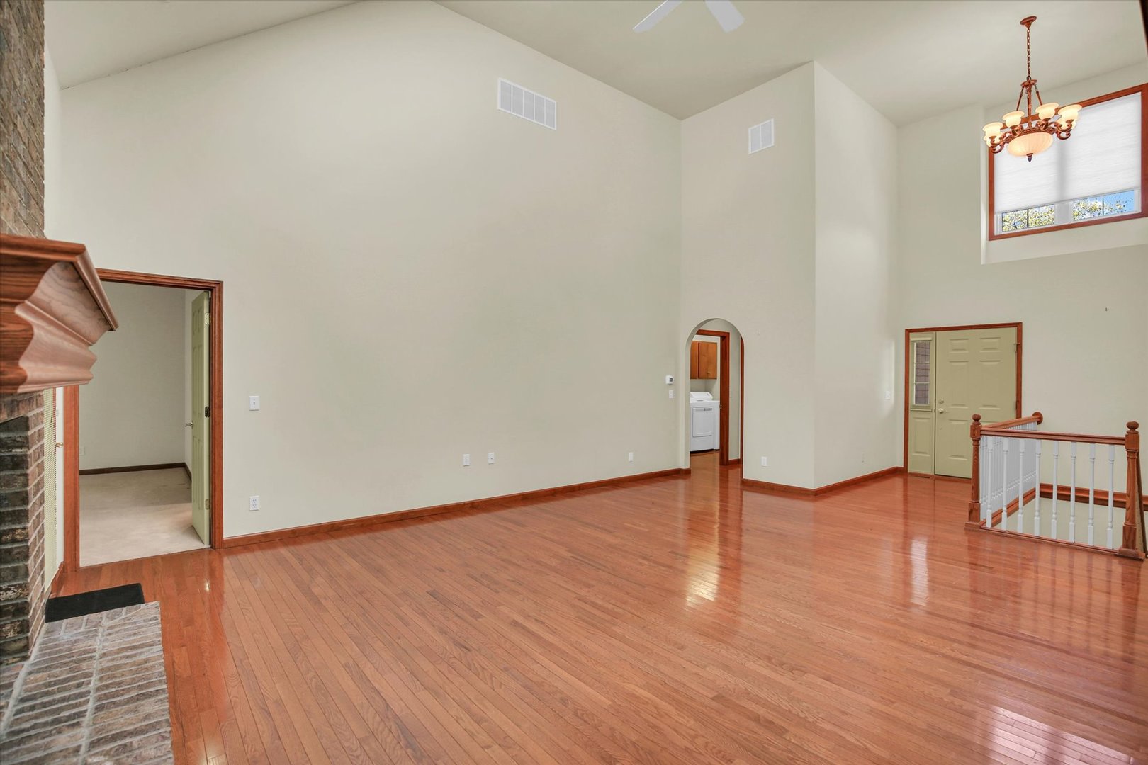 2424 Prairie Ridge Place Champaign, IL 61822 - Photo 7 of 48 wooden floor in an empty room with a window