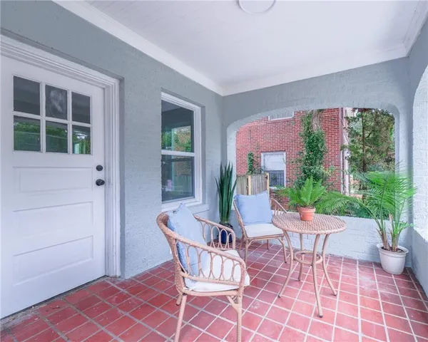 a outdoor space with a couch and chairs