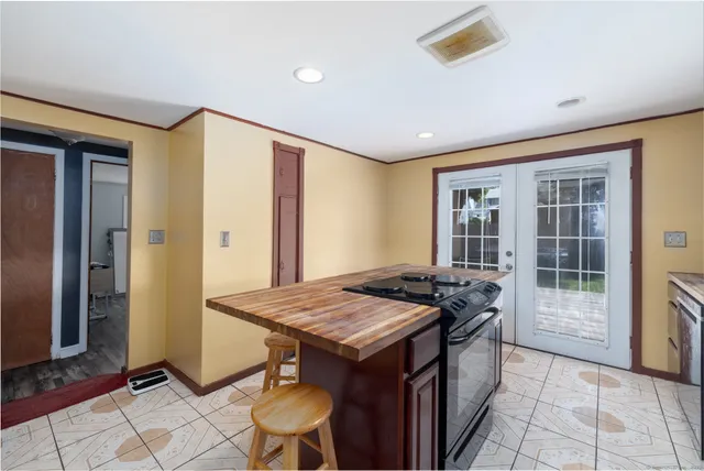 a kitchen that has a sink and a stove in it