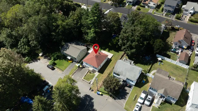 an aerial view of a house with outdoor space