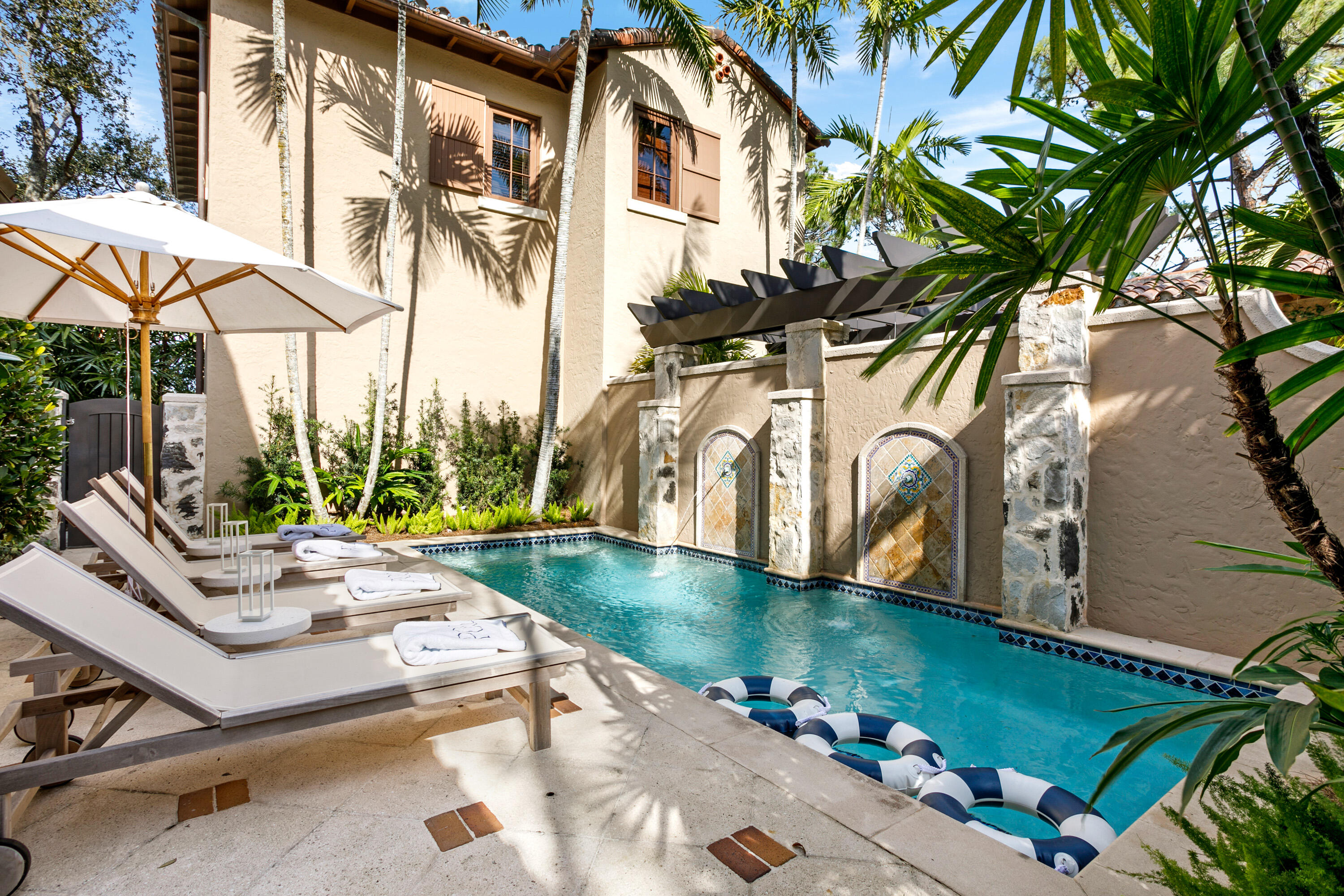 304 Villa Drive Jupiter, FL 33477 - Photo 37 of 43 a view of a swimming pool with a patio