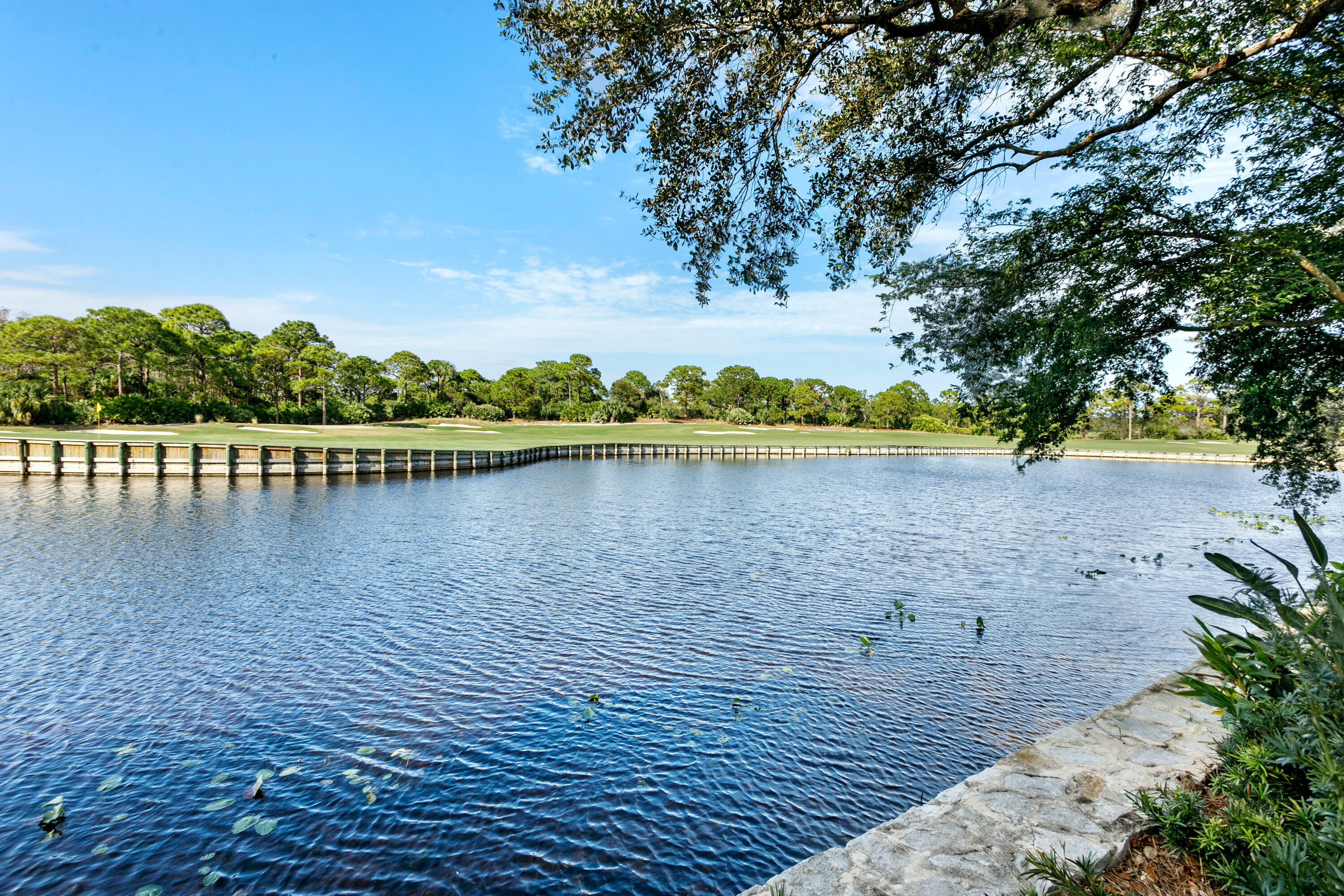 304 Villa Drive Jupiter, FL 33477 - Photo 42 of 43 a view of a lake with houses in the back
