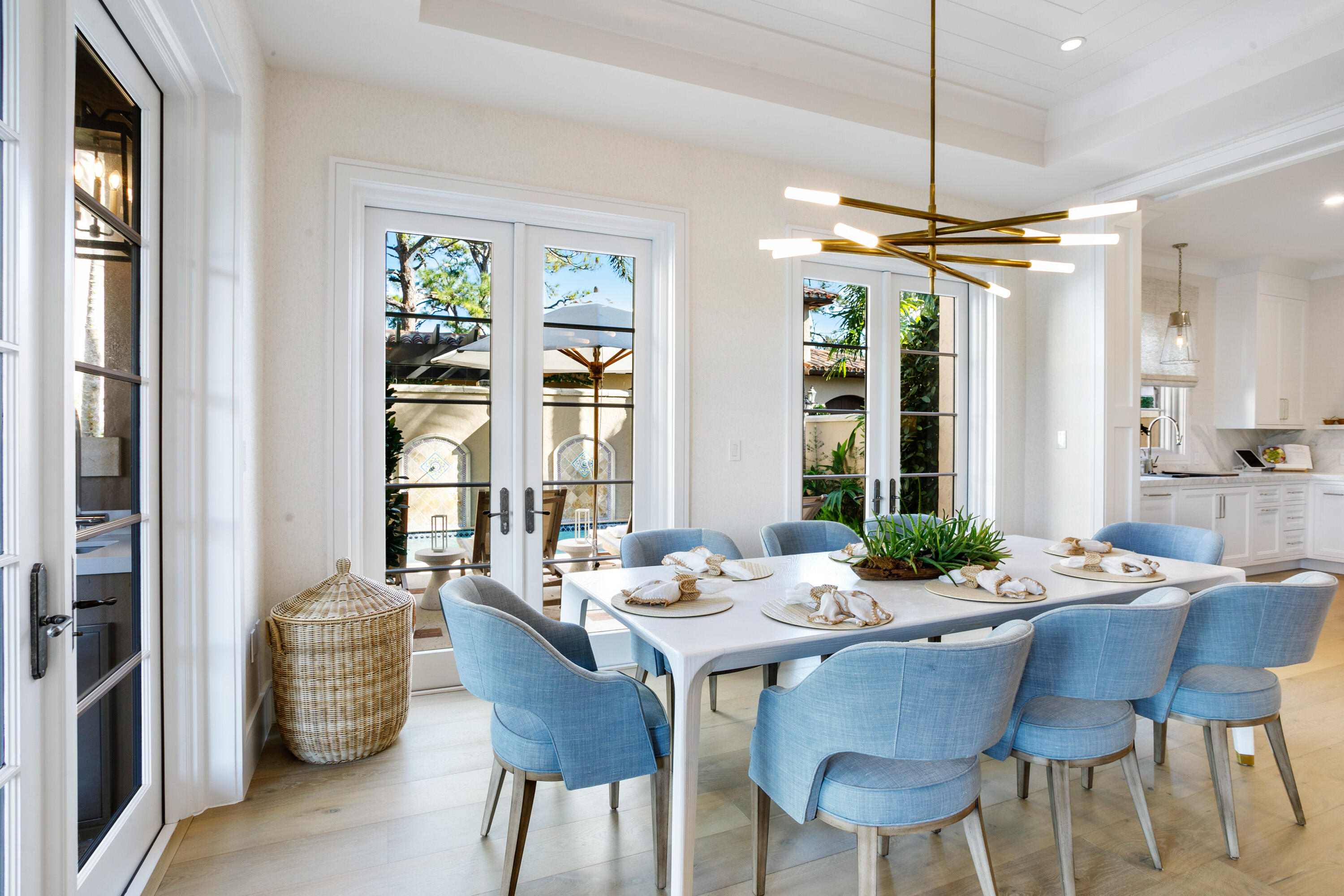 304 Villa Drive Jupiter, FL 33477 - Photo 8 of 43 a dining room with furniture a chandelier and wooden floor